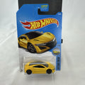 Hot Wheels 1:64 scale 2017 Acura NSX diecast car in bright yellow in original unopened blister pack
