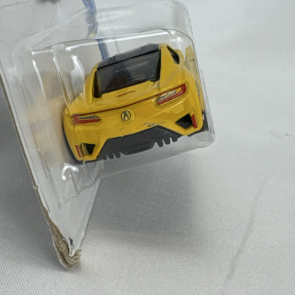 Hot Wheels 1:64 scale 2017 Acura NSX diecast car in bright yellow in original unopened blister pack