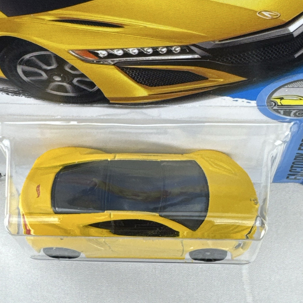 Hot Wheels 1:64 scale 2017 Acura NSX diecast car in bright yellow in original unopened blister pack