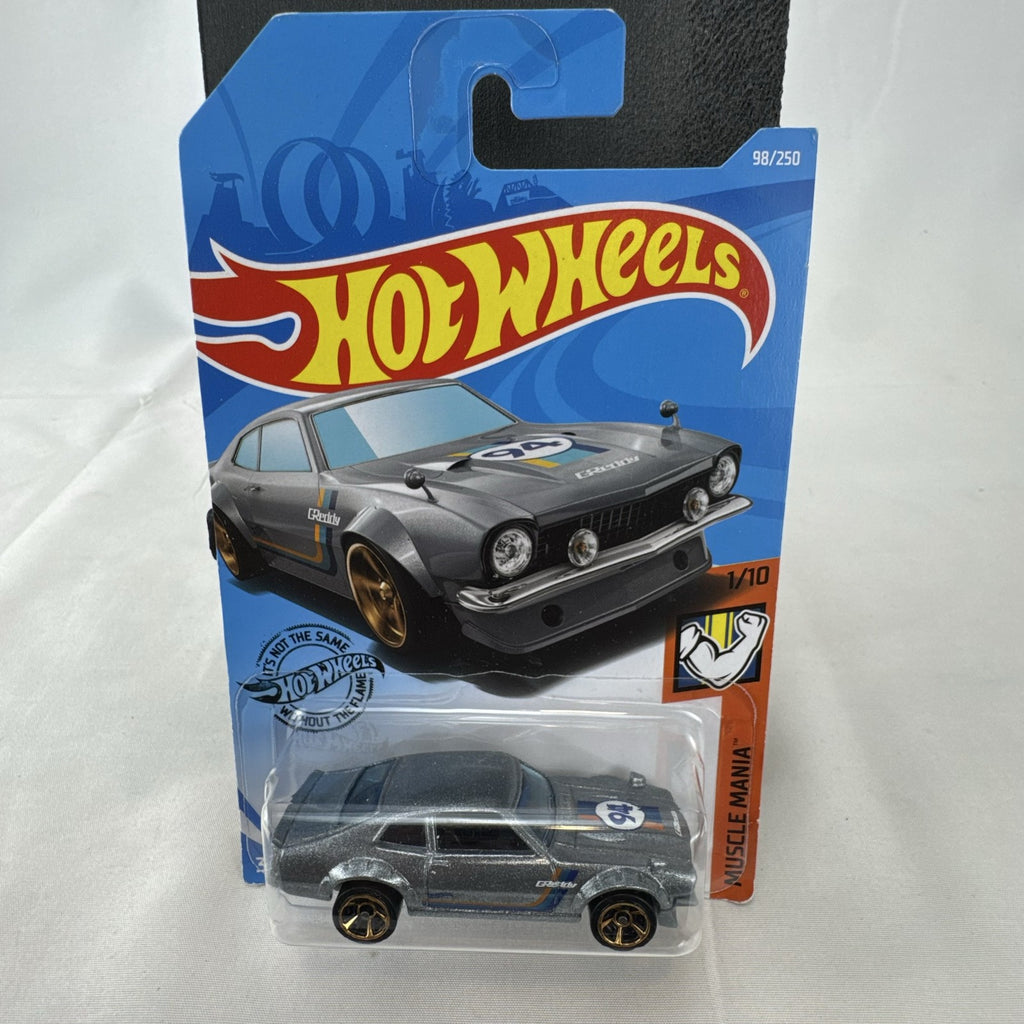 Hot Wheels 1:64 scale Custom Ford Maverick diecast car in metallic gray with GReddy livery on original card