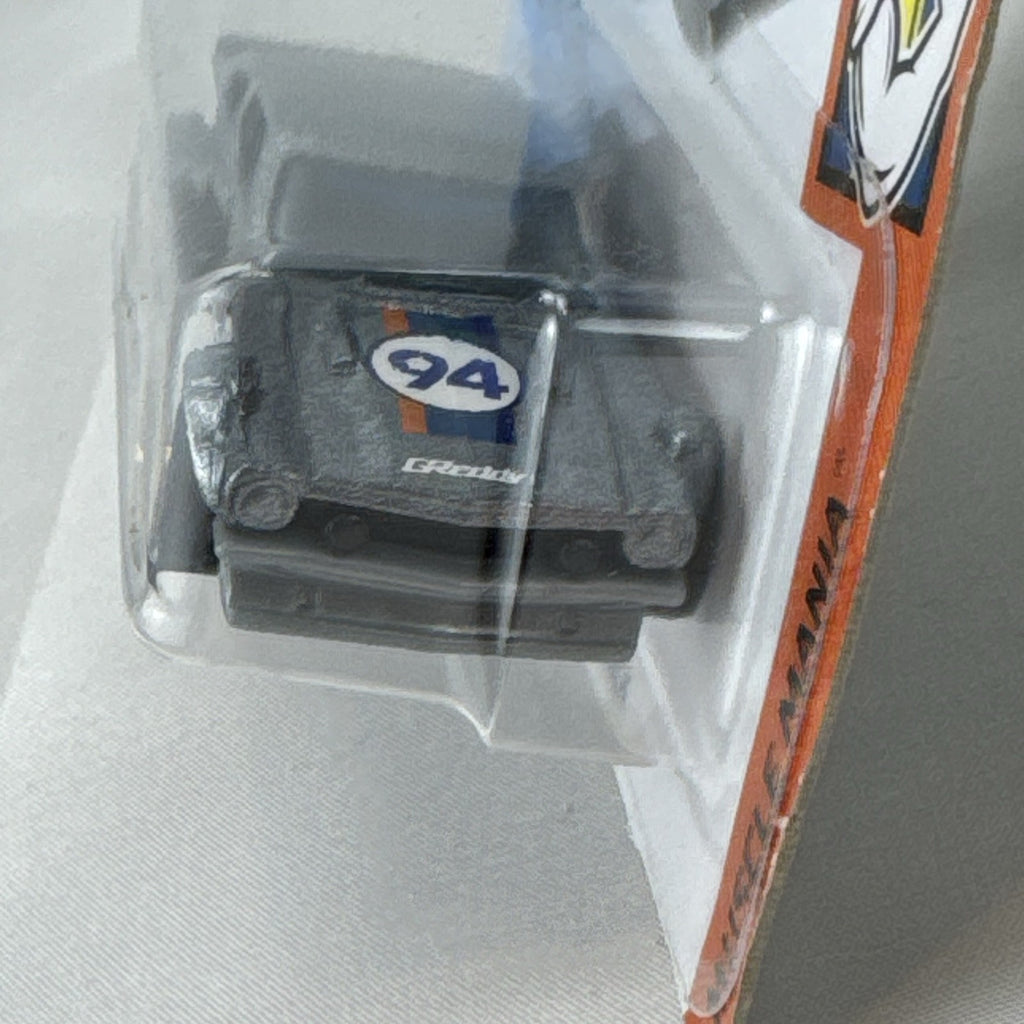 Hot Wheels 1:64 scale Custom Ford Maverick diecast car in metallic gray with GReddy livery on original card