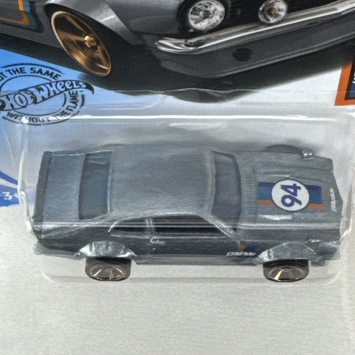 Hot Wheels 1:64 scale Custom Ford Maverick diecast car in metallic gray with GReddy livery on original card