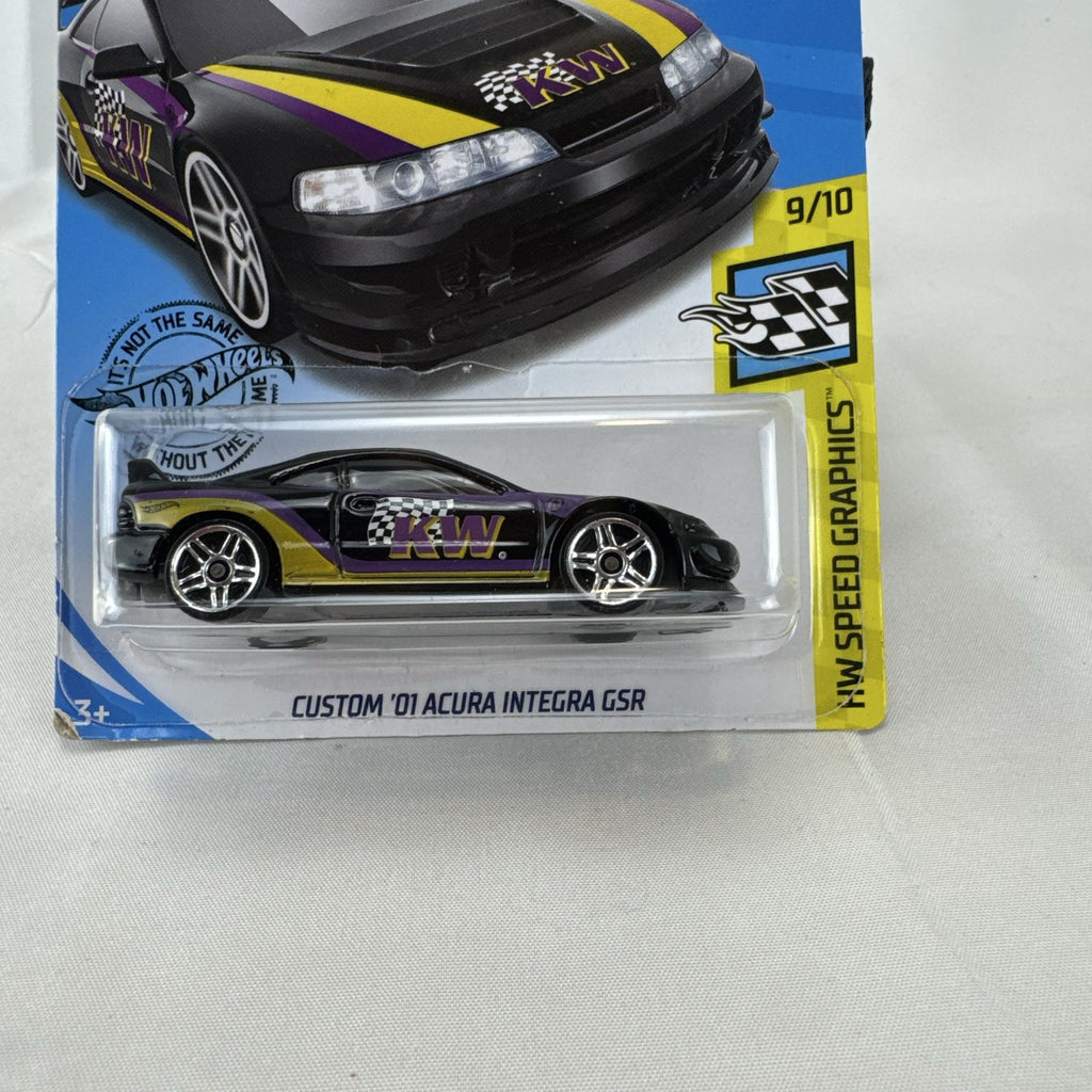 Hot Wheels 1:64 diecast Custom 01 Acura Integra GSR in black with yellow and purple KW suspension graphics on card.