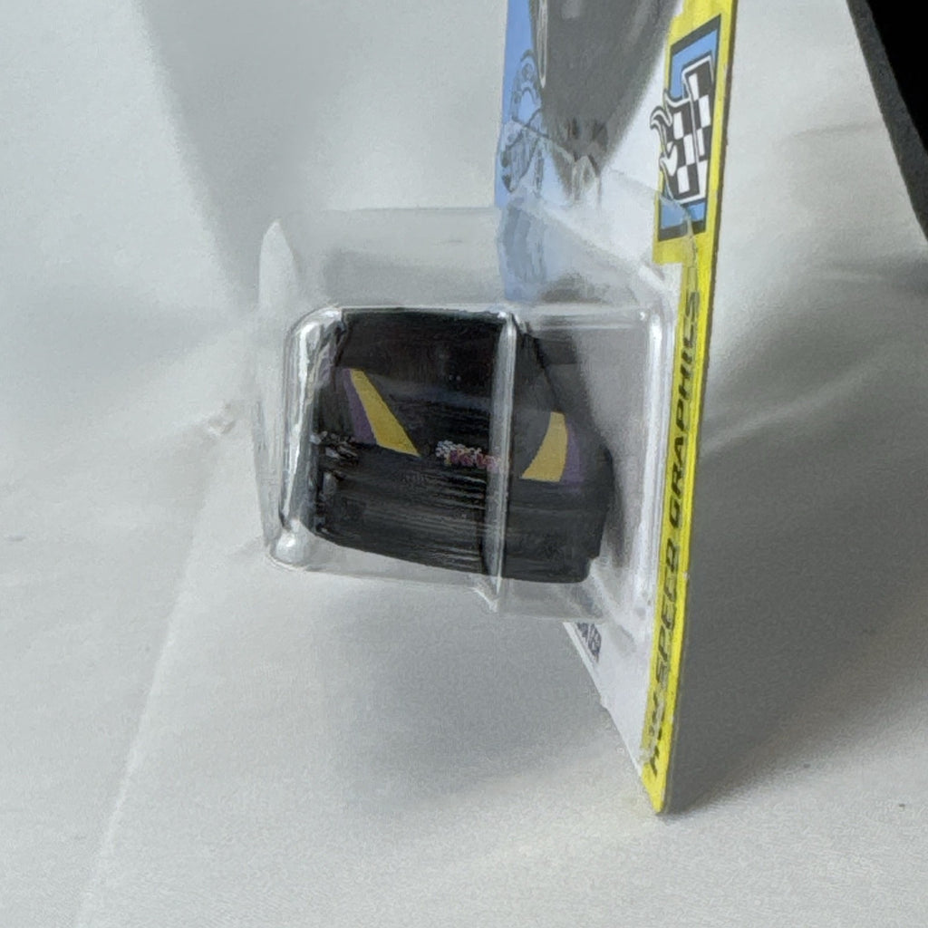 Hot Wheels 1:64 diecast Custom 01 Acura Integra GSR in black with yellow and purple KW suspension graphics on card.