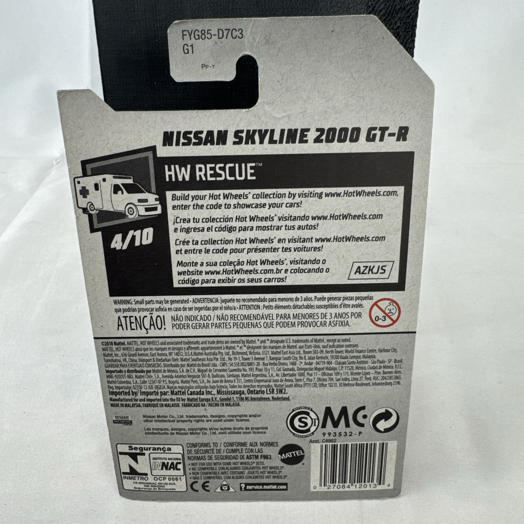 Sealed Hot Wheels 1:64 scale red Nissan Skyline 2000 GT-R HW Rescue Japanese police car diecast in blister pack.