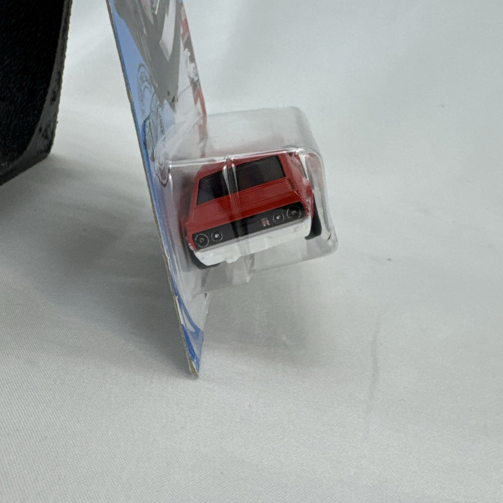 Sealed Hot Wheels 1:64 scale red Nissan Skyline 2000 GT-R HW Rescue Japanese police car diecast in blister pack.