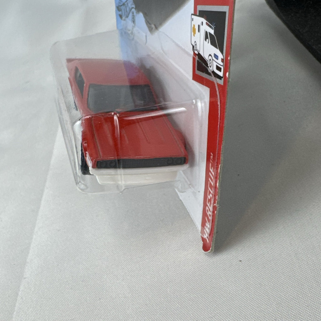 Sealed Hot Wheels 1:64 scale red Nissan Skyline 2000 GT-R HW Rescue Japanese police car diecast in blister pack.
