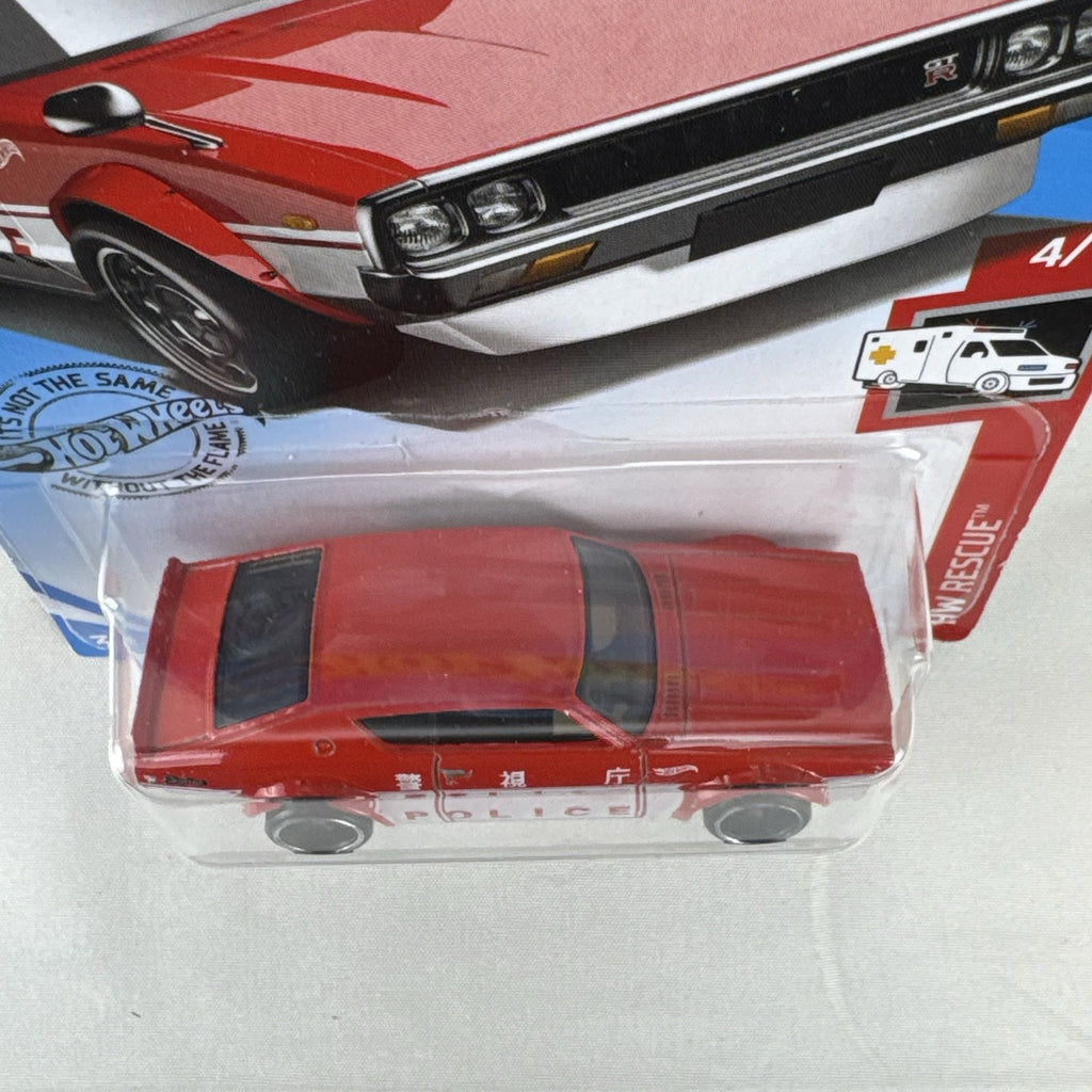 Sealed Hot Wheels 1:64 scale red Nissan Skyline 2000 GT-R HW Rescue Japanese police car diecast in blister pack.