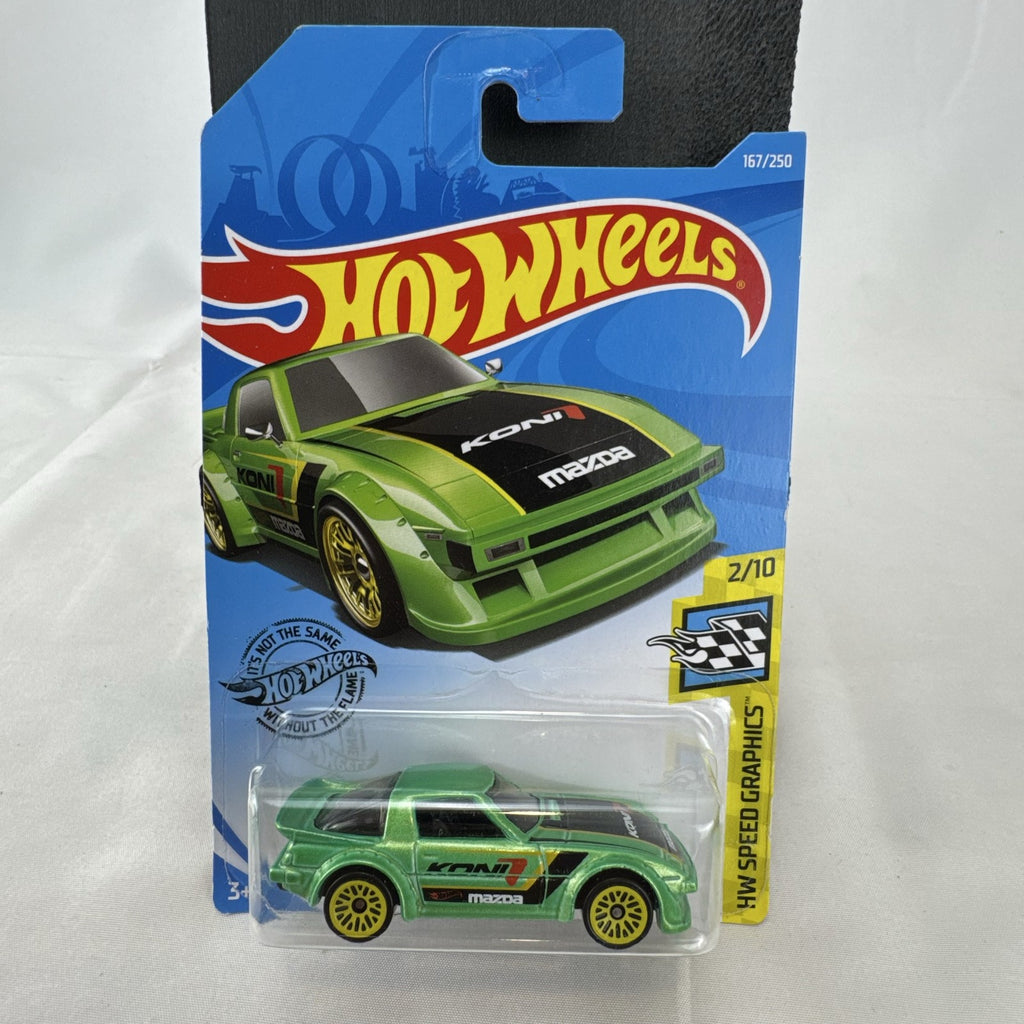 Hot Wheels 1:64 scale metallic green Mazda RX-7 diecast car with KONI graphics in factory sealed packaging.