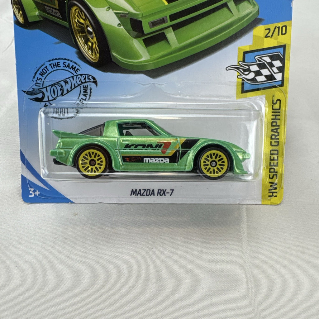 Hot Wheels 1:64 scale metallic green Mazda RX-7 diecast car with KONI graphics in factory sealed packaging.