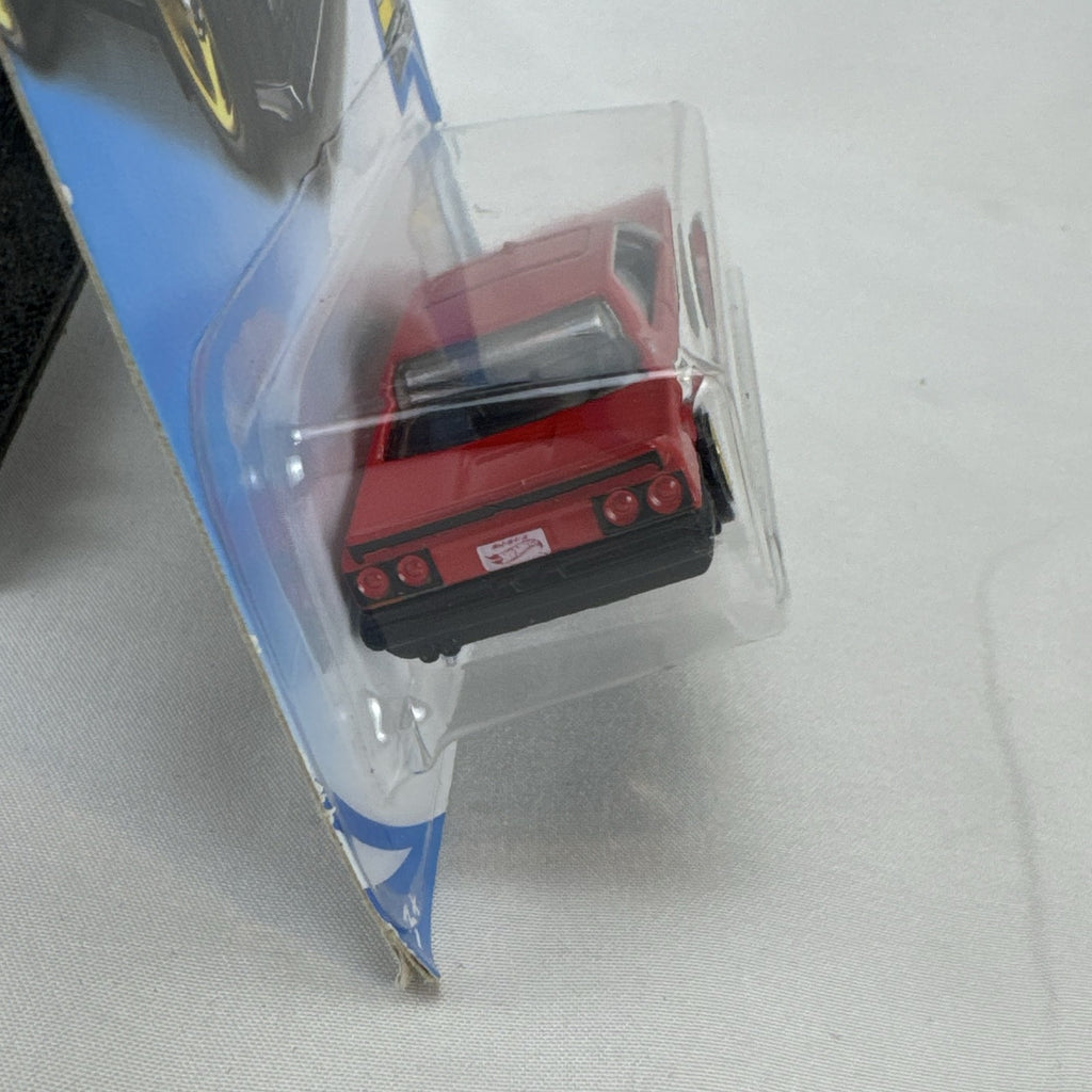 Hot Wheels 1982 Nissan Skyline R30 1:64 scale diecast car in factory-sealed packaging with red and black two-tone finish
