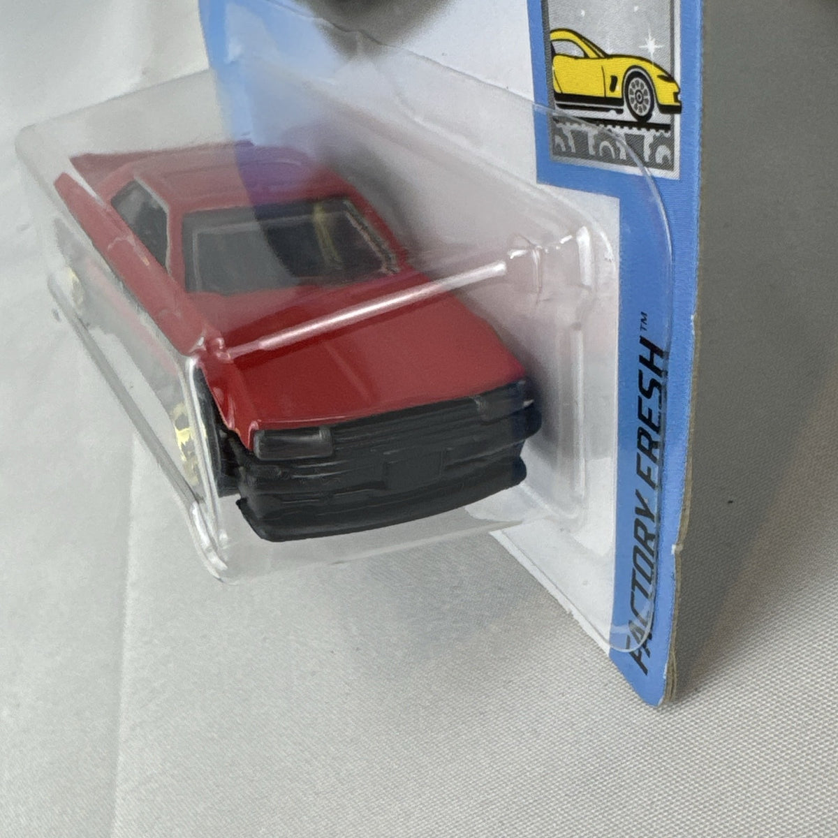 Hot Wheels 1982 Nissan Skyline R30 1:64 scale diecast car in factory-sealed packaging with red and black two-tone finish