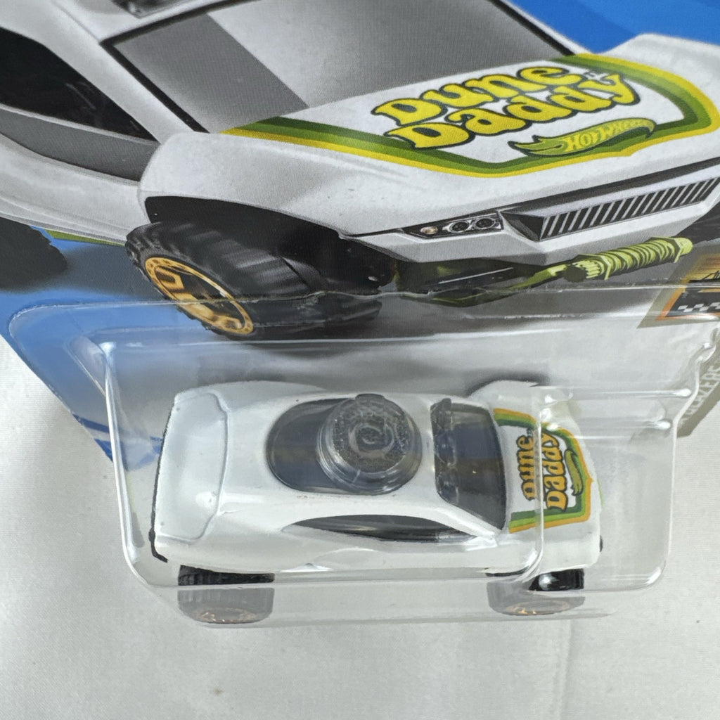 Sealed Hot Wheels 1:64 scale Dune Daddy diecast dune buggy in white with Baja Blazers graphics and gold-chrome rims.