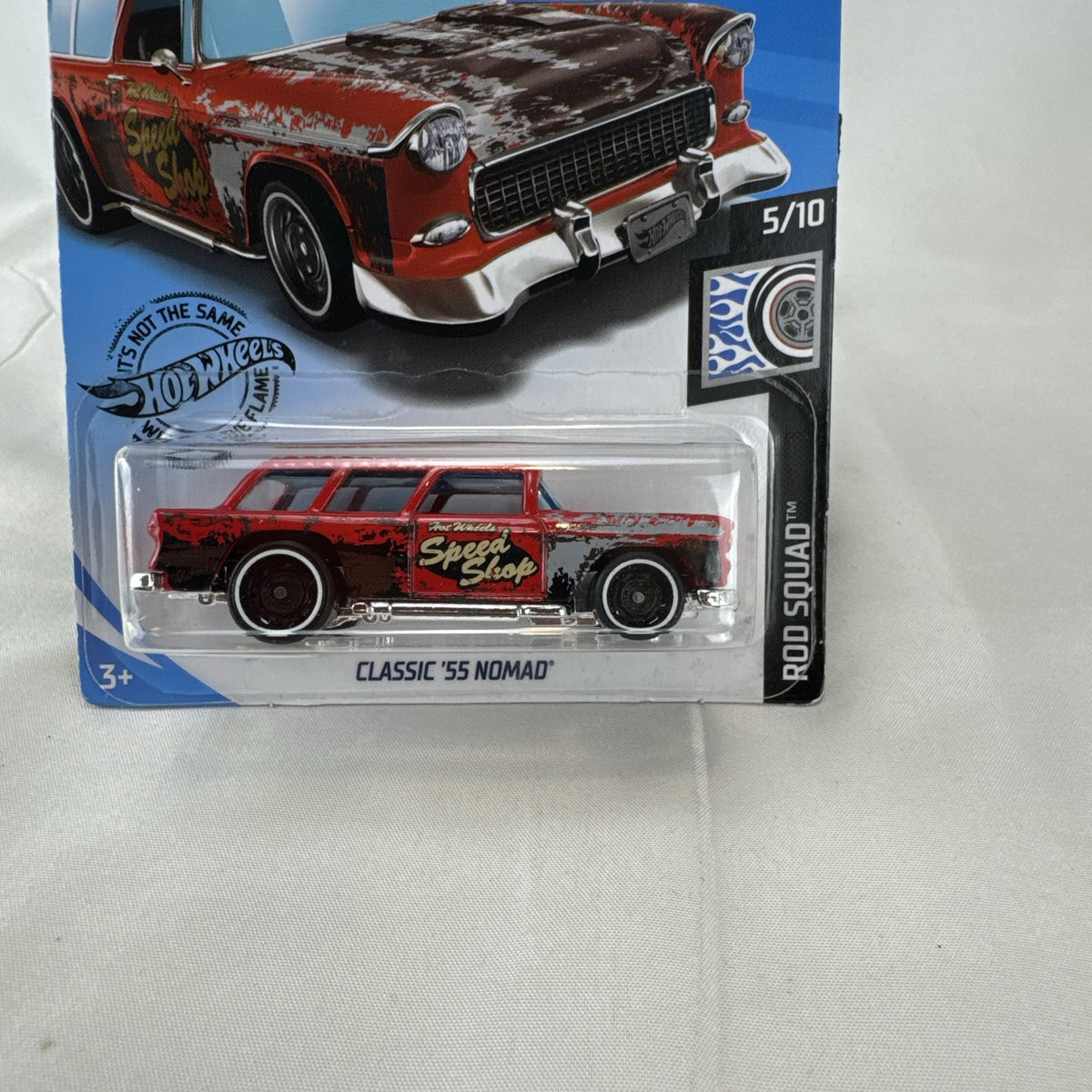 Sealed Hot Wheels 1955 Chevy Nomad diecast car in weathered red from the Rod Squad series