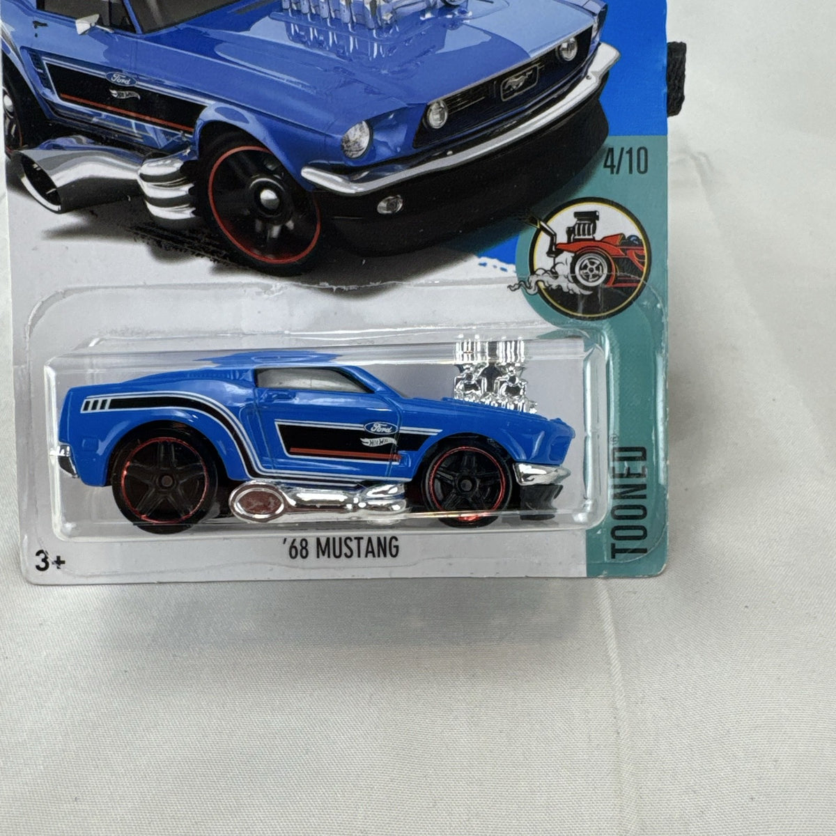 Hot Wheels Tooned 1968 Ford Mustang 1:64 scale diecast car in blue on blister card