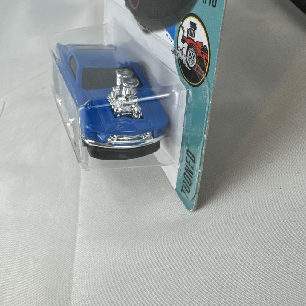 Hot Wheels Tooned 1968 Ford Mustang 1:64 scale diecast car in blue on blister card
