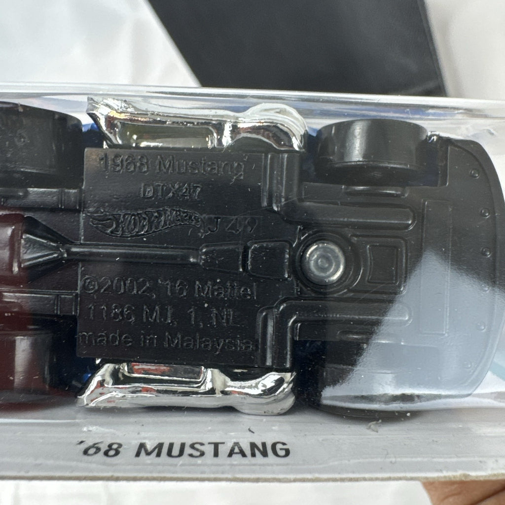 Hot Wheels Tooned '68 Ford Mustang 1:64 diecast car in blue with chrome engine in original packaging