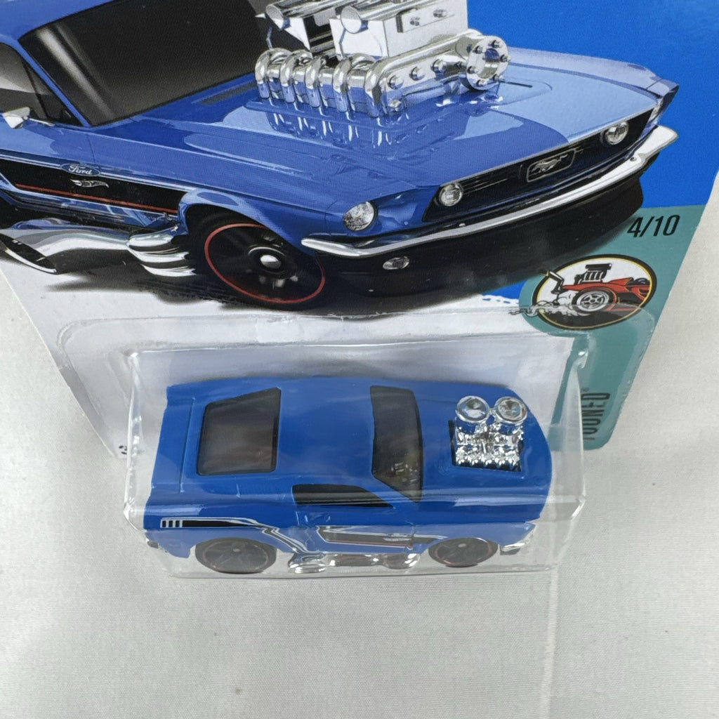 Hot Wheels Tooned '68 Ford Mustang 1:64 diecast car in blue with chrome engine in original packaging