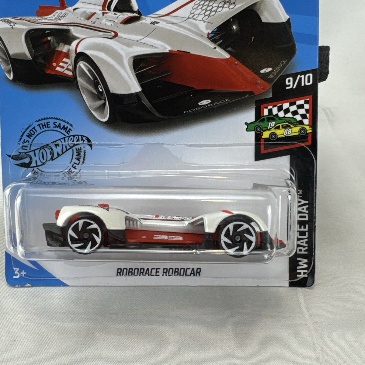 Hot Wheels 1:64 scale diecast Roborace Robocar in white with red accents in original blister pack.