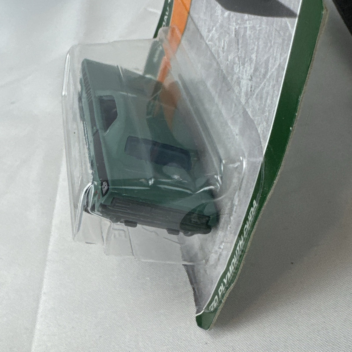 Matchbox 1970 Plymouth Cuda 1:64 scale diecast car in metallic green on original card