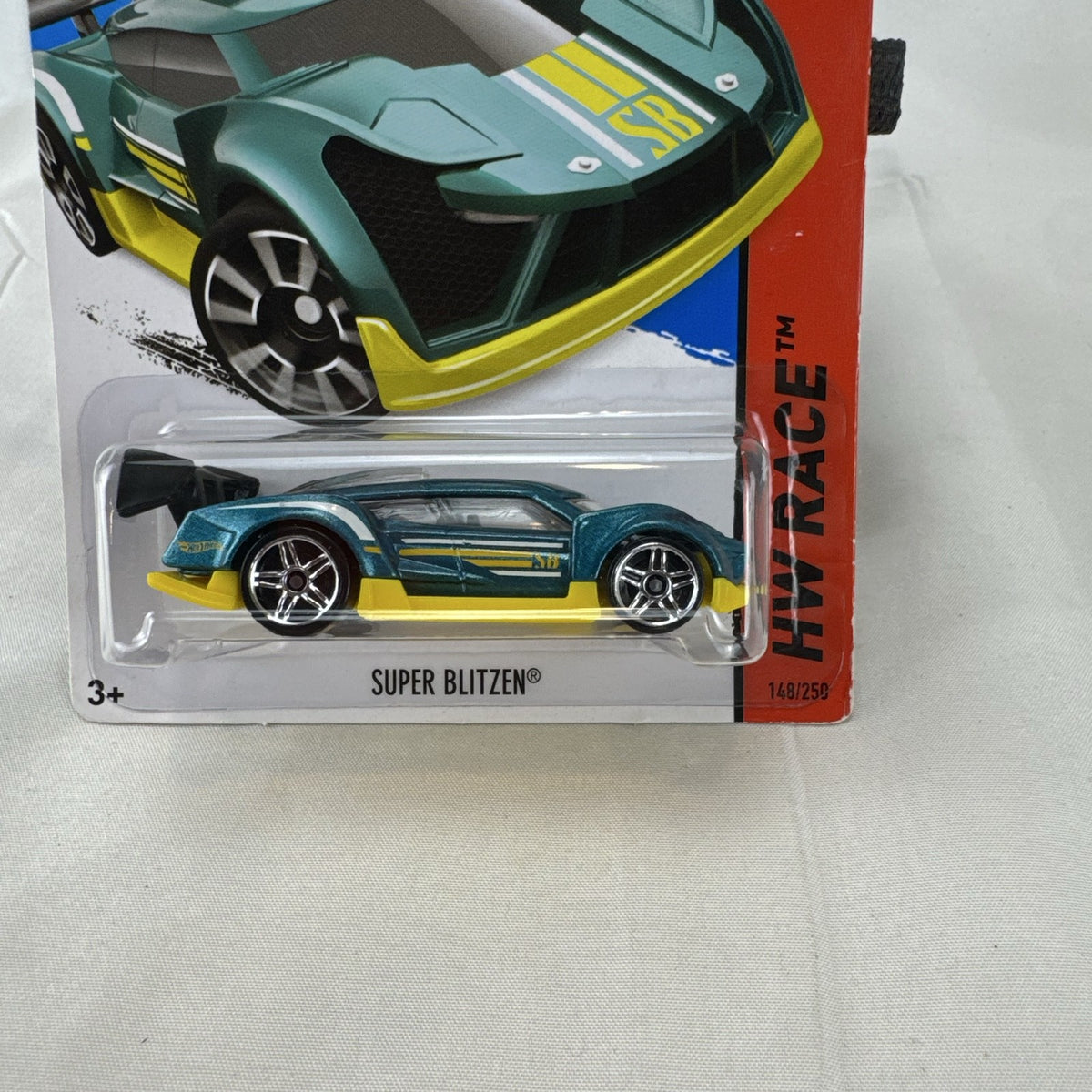 Hot Wheels Super Blitzen 1:64 diecast racer in metallic blue, packaged on original 2015 blister card.