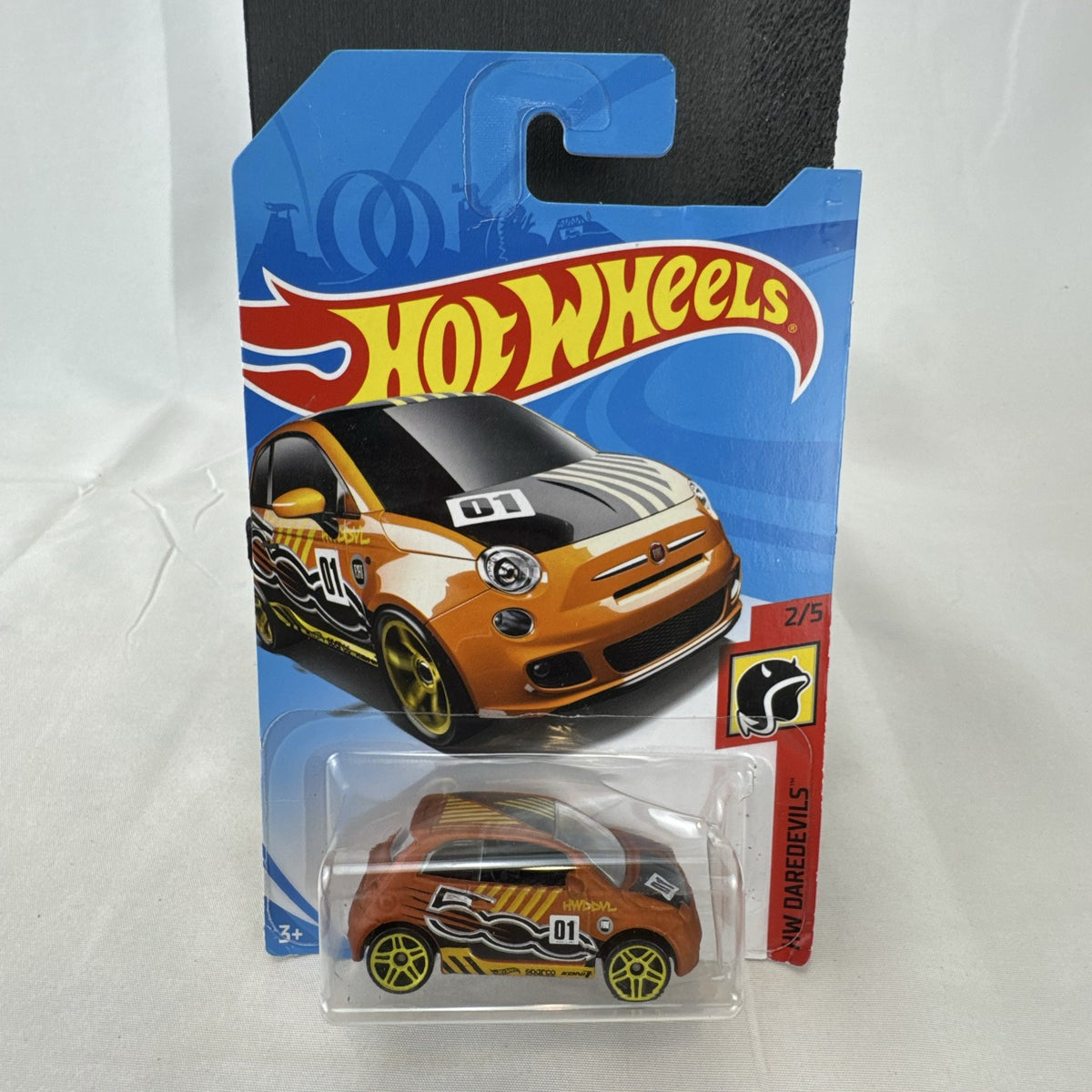 Hot Wheels Fiat 500 diecast car in bright orange sealed in HW Daredevils short card packaging