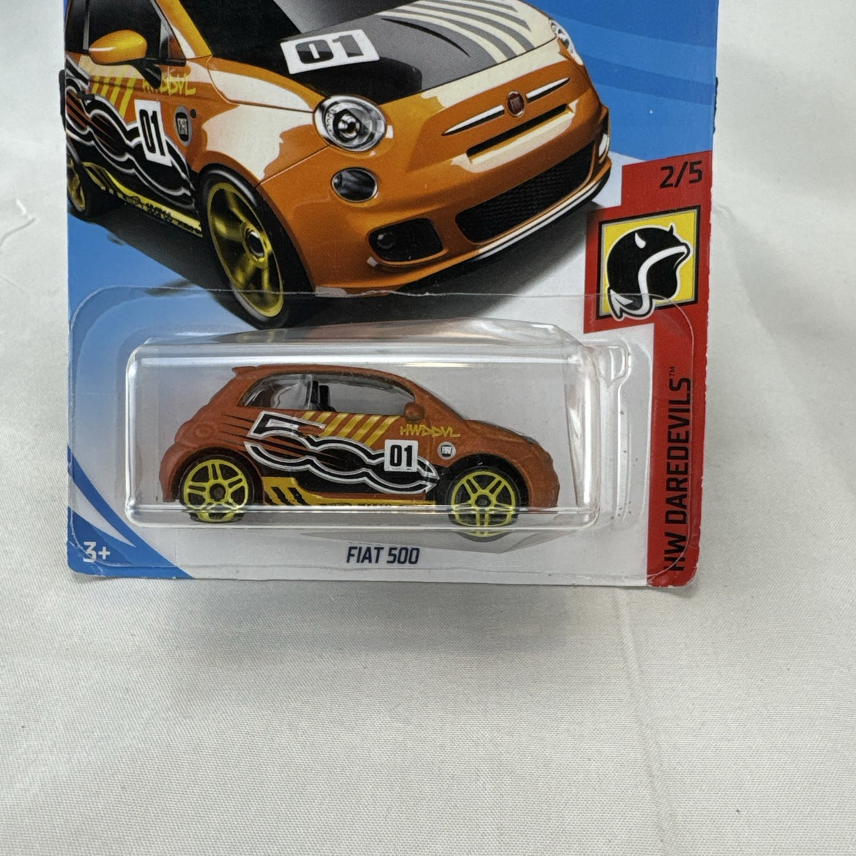 Hot Wheels Fiat 500 diecast car in bright orange sealed in HW Daredevils short card packaging