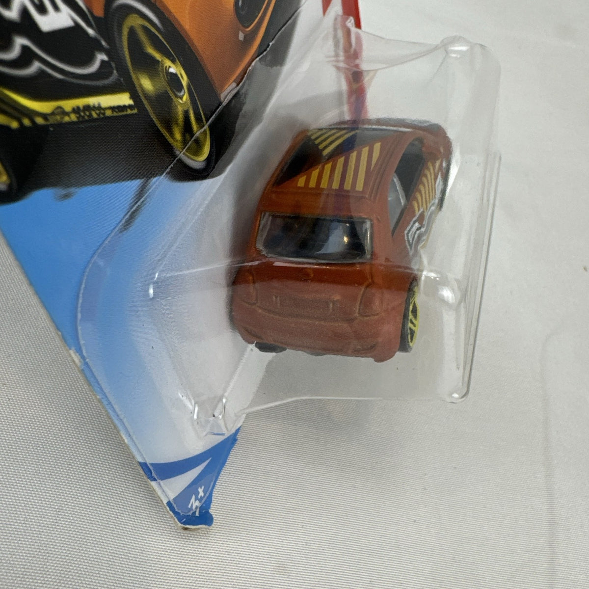 Hot Wheels Fiat 500 diecast car in bright orange sealed in HW Daredevils short card packaging