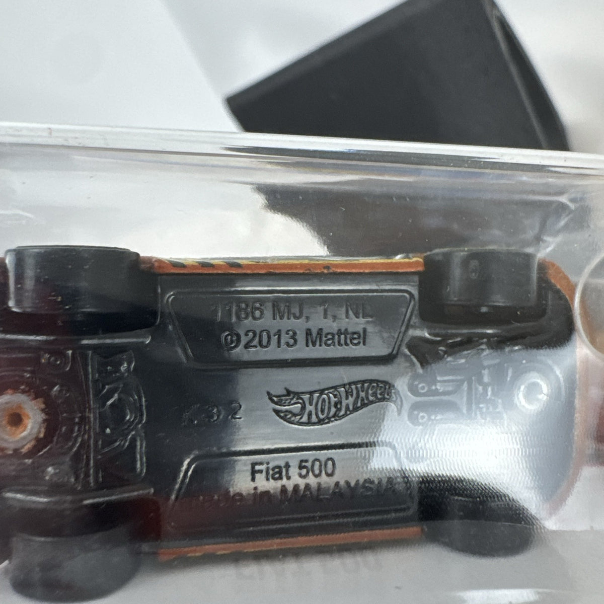 Hot Wheels Fiat 500 diecast car in bright orange sealed in HW Daredevils short card packaging