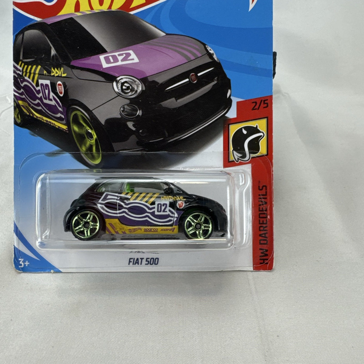 Hot Wheels HW Daredevils Fiat 500 diecast car in black with green wheels in original packaging