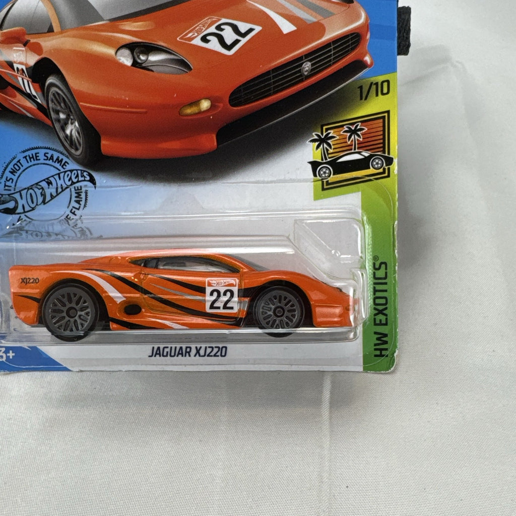 Hot Wheels HW Exotics 1:64 scale Jaguar XJ220 diecast car in bright orange racing livery sealed on original card