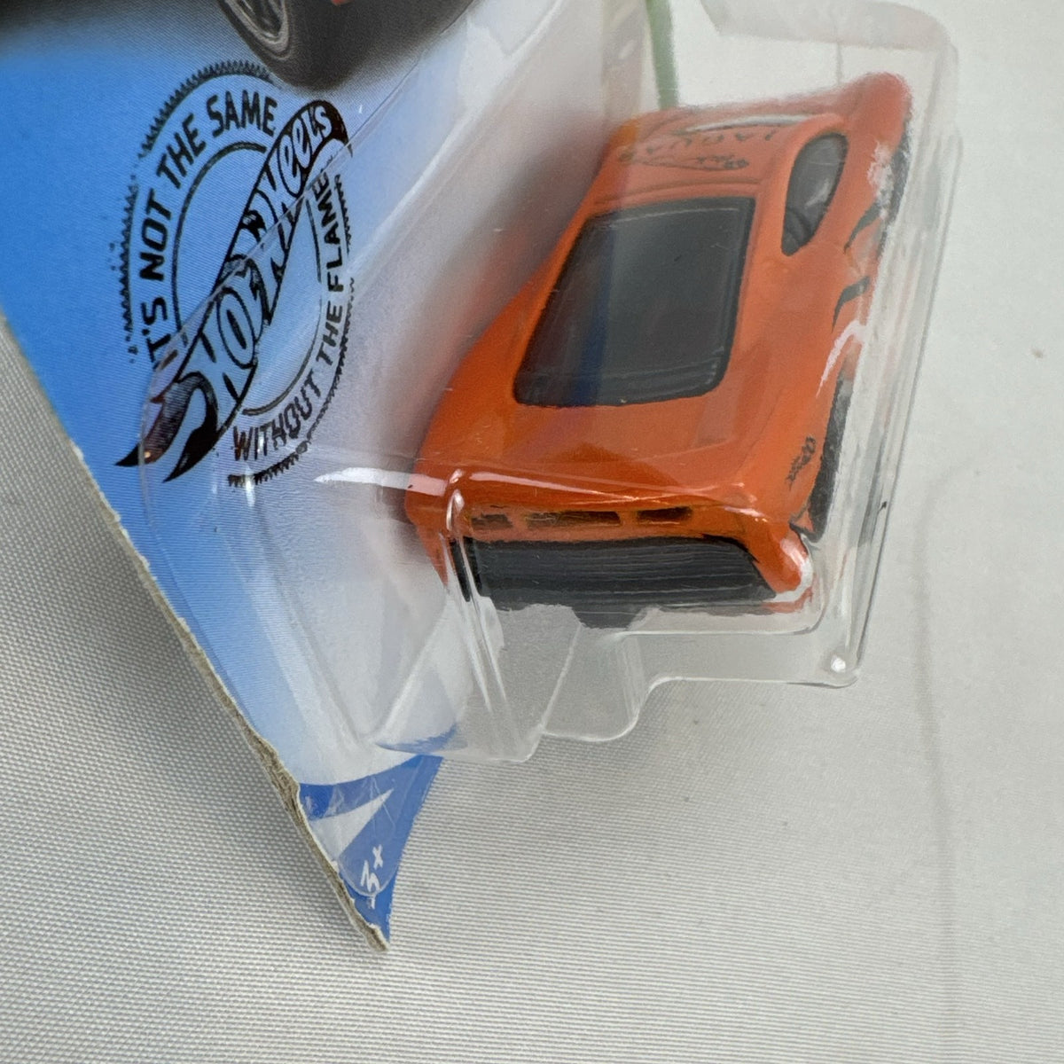 Hot Wheels HW Exotics 1:64 scale Jaguar XJ220 diecast car in bright orange racing livery sealed on original card