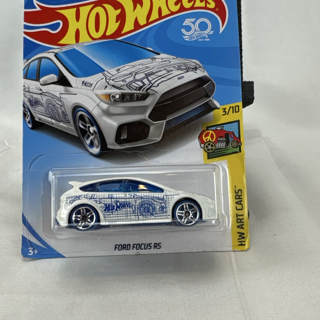 Hot Wheels 1:64 Ford Focus RS diecast car in white with blue blueprint graphics from the HW Art Cars series