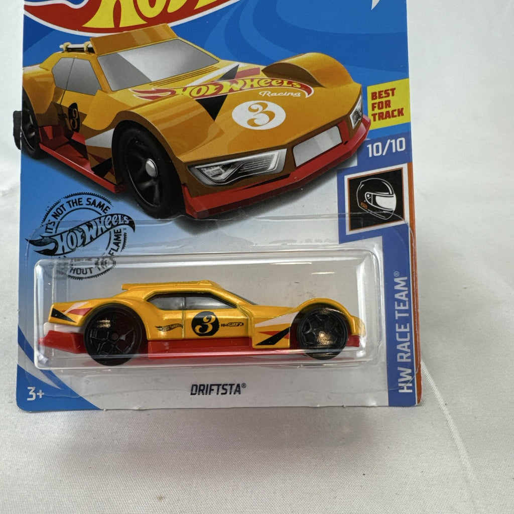 Yellow Hot Wheels 1:64 Driftsta diecast car in factory sealed HW Race Team blister card packaging