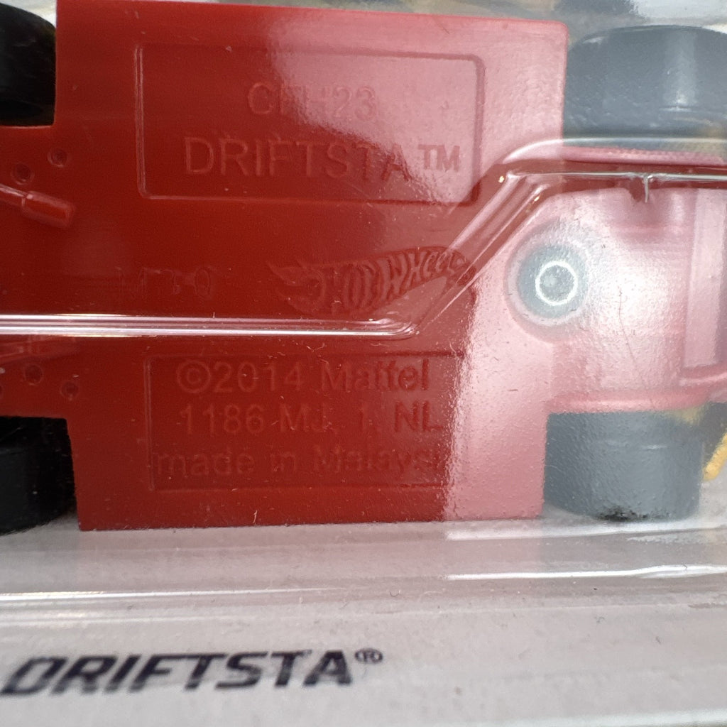 Yellow Hot Wheels 1:64 Driftsta diecast car in factory sealed HW Race Team blister card packaging