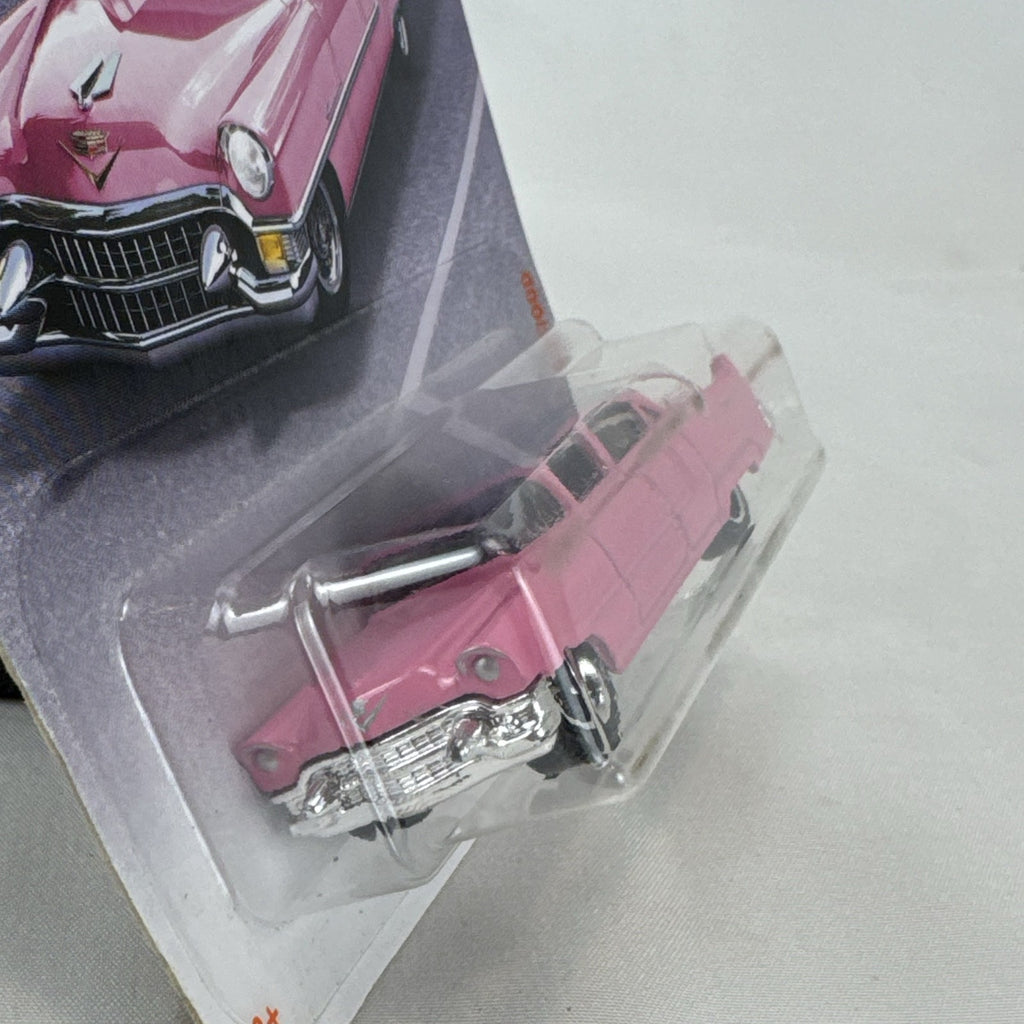 Matchbox 1:64 scale 1955 Cadillac Fleetwood diecast car in pink with grey roof sealed on original backing card.