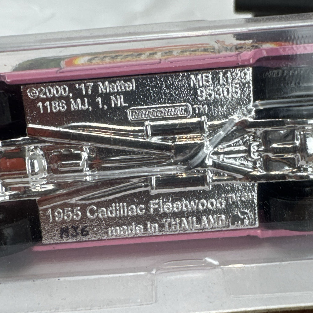 Matchbox 1:64 scale 1955 Cadillac Fleetwood diecast car in pink with grey roof sealed on original backing card.