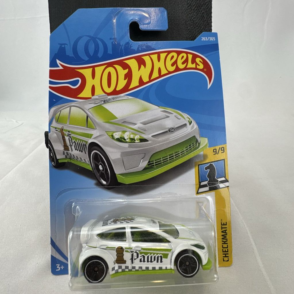 Hot Wheels 1:64 scale 2012 Ford Fiesta diecast car in white with green Pawn Checkmate graphics, sealed on card.