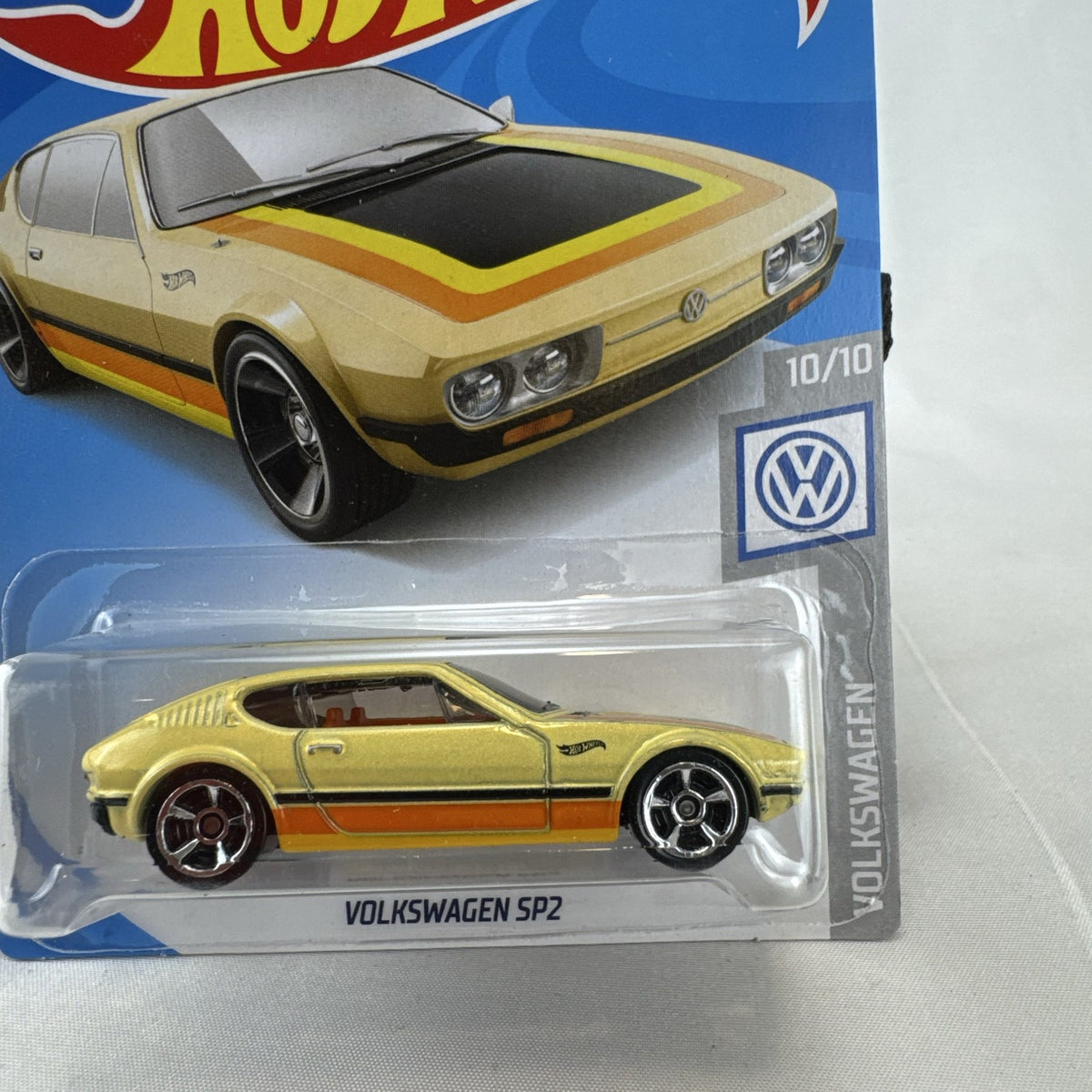 Hot Wheels 1:64 scale Volkswagen SP2 diecast car in metallic gold on original blister packaging.