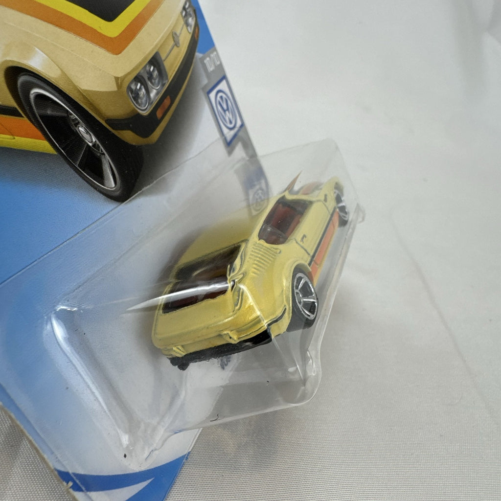 Hot Wheels 1:64 scale Volkswagen SP2 diecast car in metallic gold on original blister packaging.