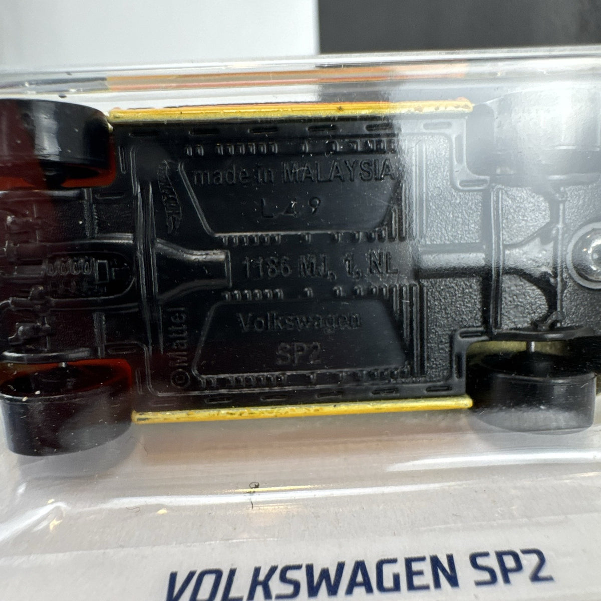 Hot Wheels 1:64 scale Volkswagen SP2 diecast car in metallic gold on original blister packaging.