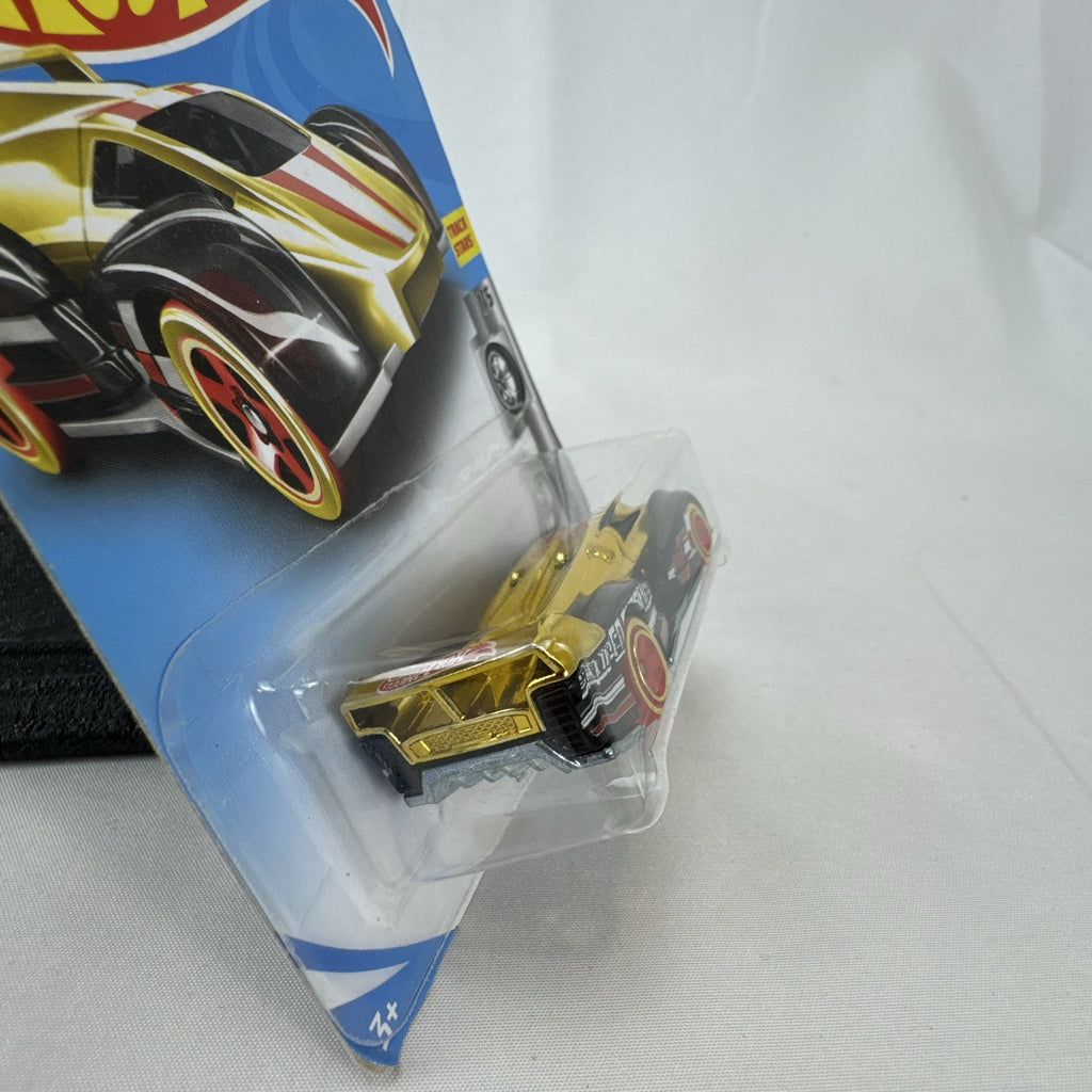 Factory sealed Hot Wheels ElecTrack 1:64 diecast car in gold chrome with red and white racing stripes on original card.