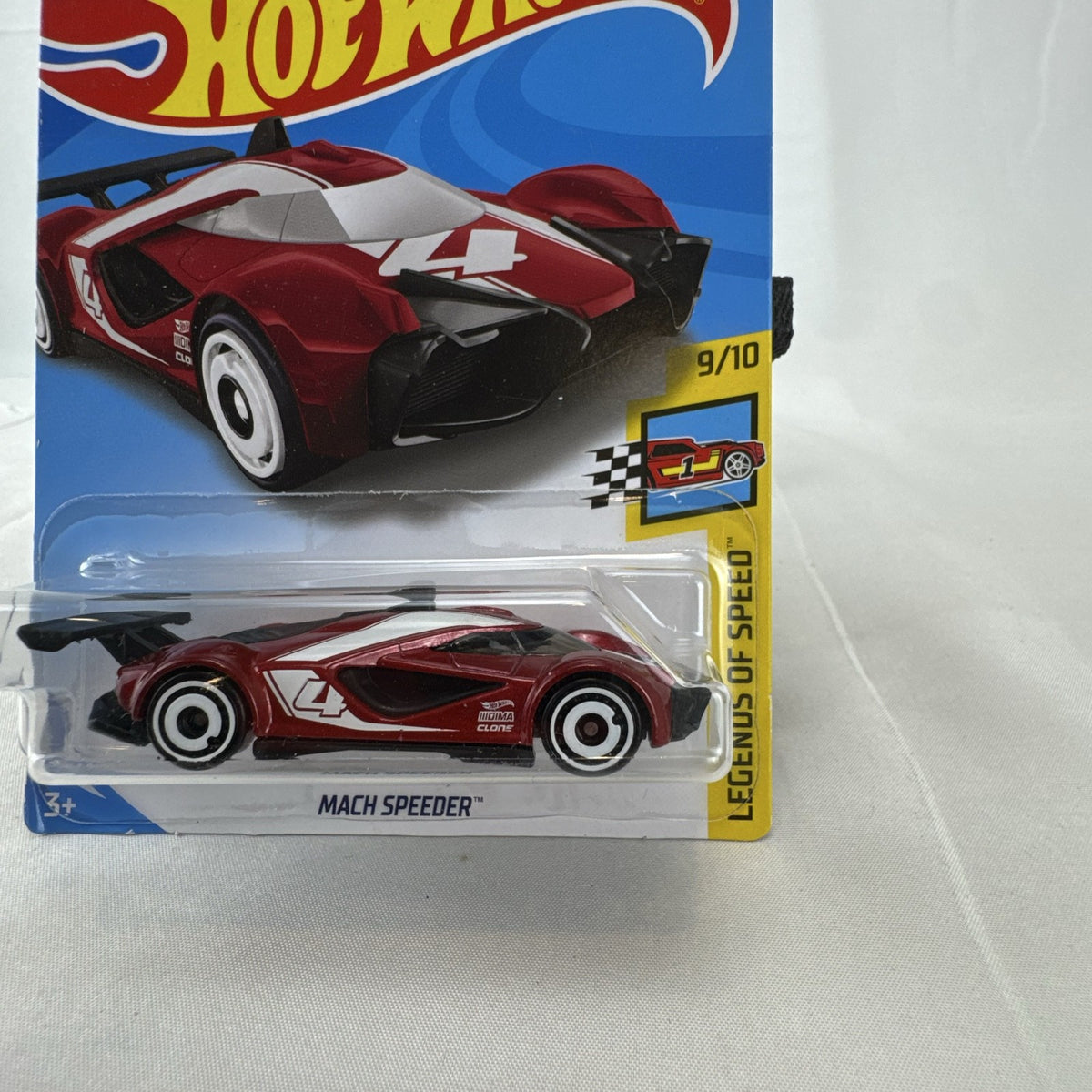 Hot Wheels 1:64 scale red Mach Speeder diecast car sealed on original Legends of Speed card.