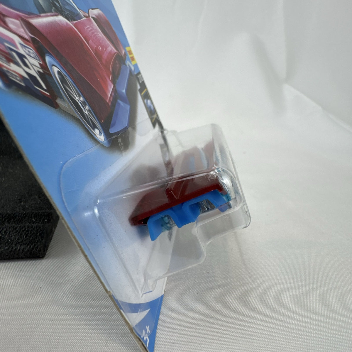 Hot Wheels Gruppo x24 1:64 scale diecast car in translucent red on original blister card