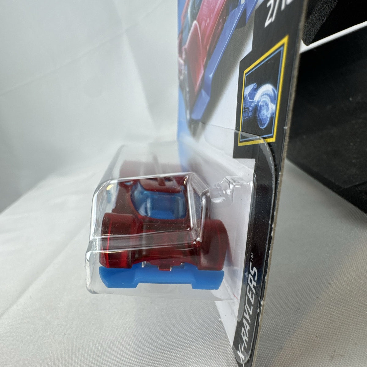 Hot Wheels Gruppo x24 1:64 scale diecast car in translucent red on original blister card