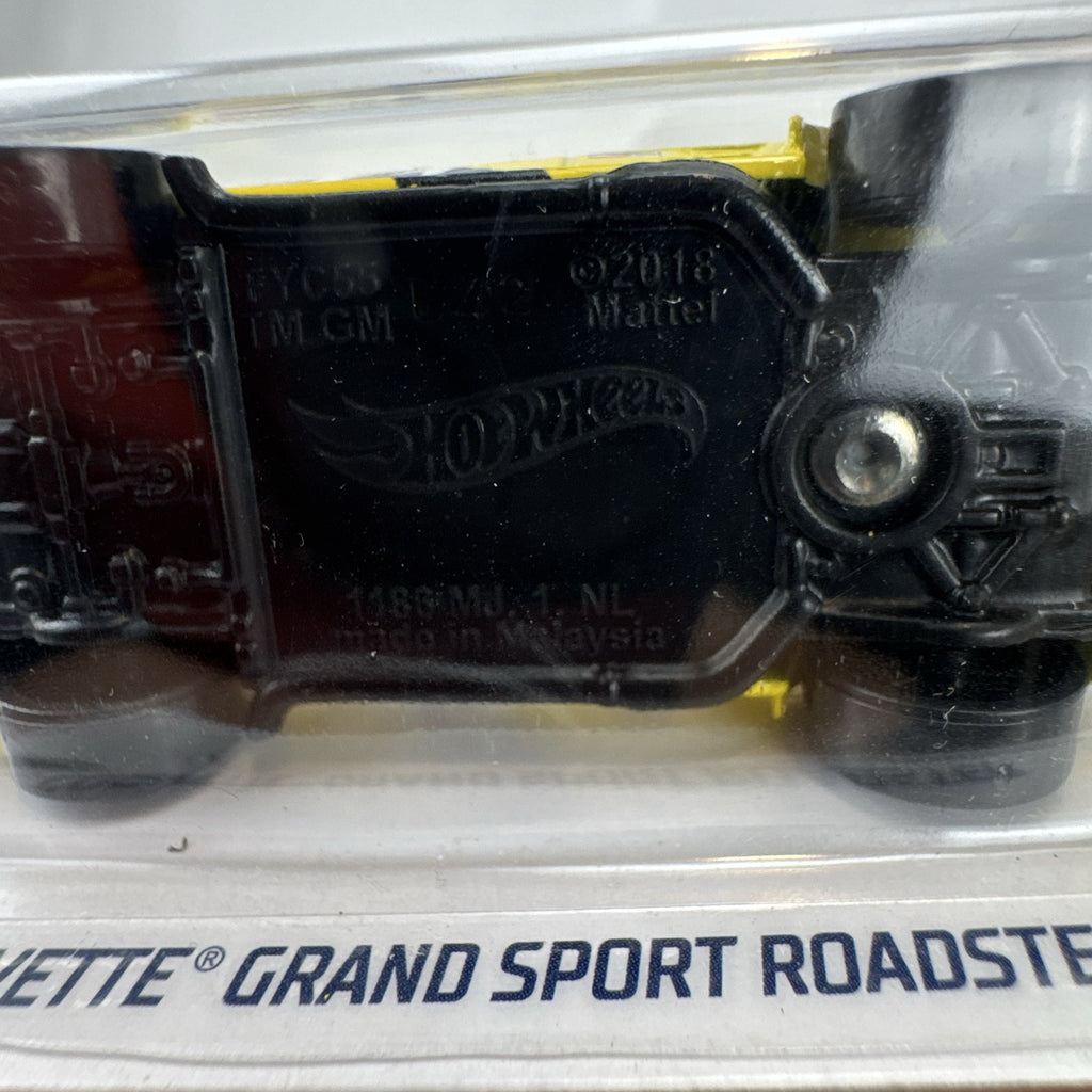 Hot Wheels 1:64 scale yellow Chevrolet Corvette Grand Sport Roadster sealed diecast car in original packaging