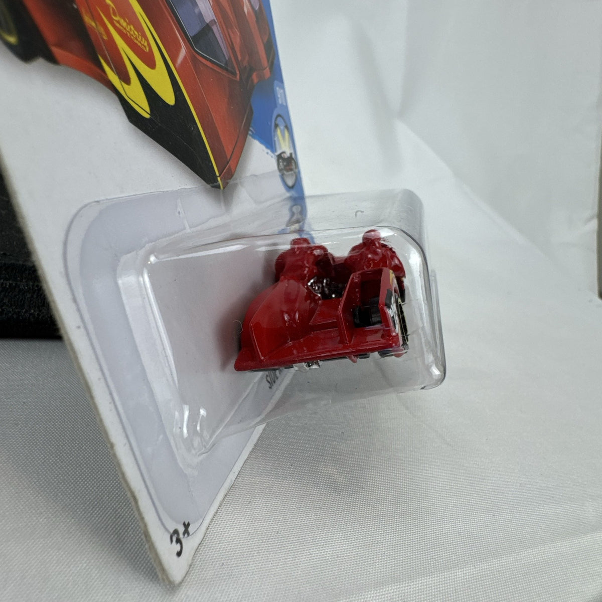 Hot Wheels 1:64 scale Side Ripper diecast car in red with flame graphics sealed on original 2016 card