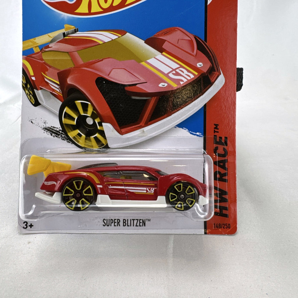 Hot Wheels Super Blitzen diecast car in red with yellow racing stripes and yellow spoiler in original blister package.