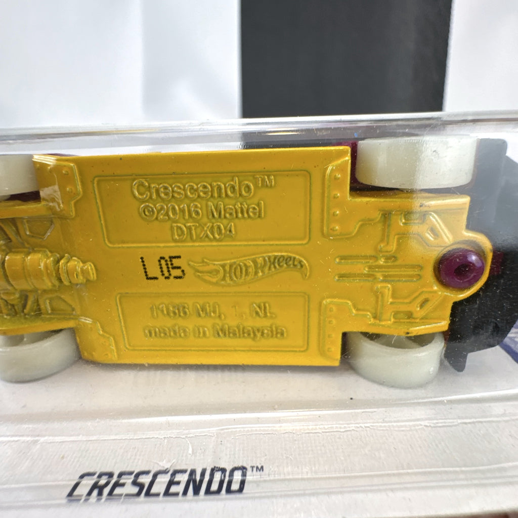 Hot Wheels 1:64 scale purple Crescendo diecast car factory sealed on 2017 HW Glow Wheels blister card.