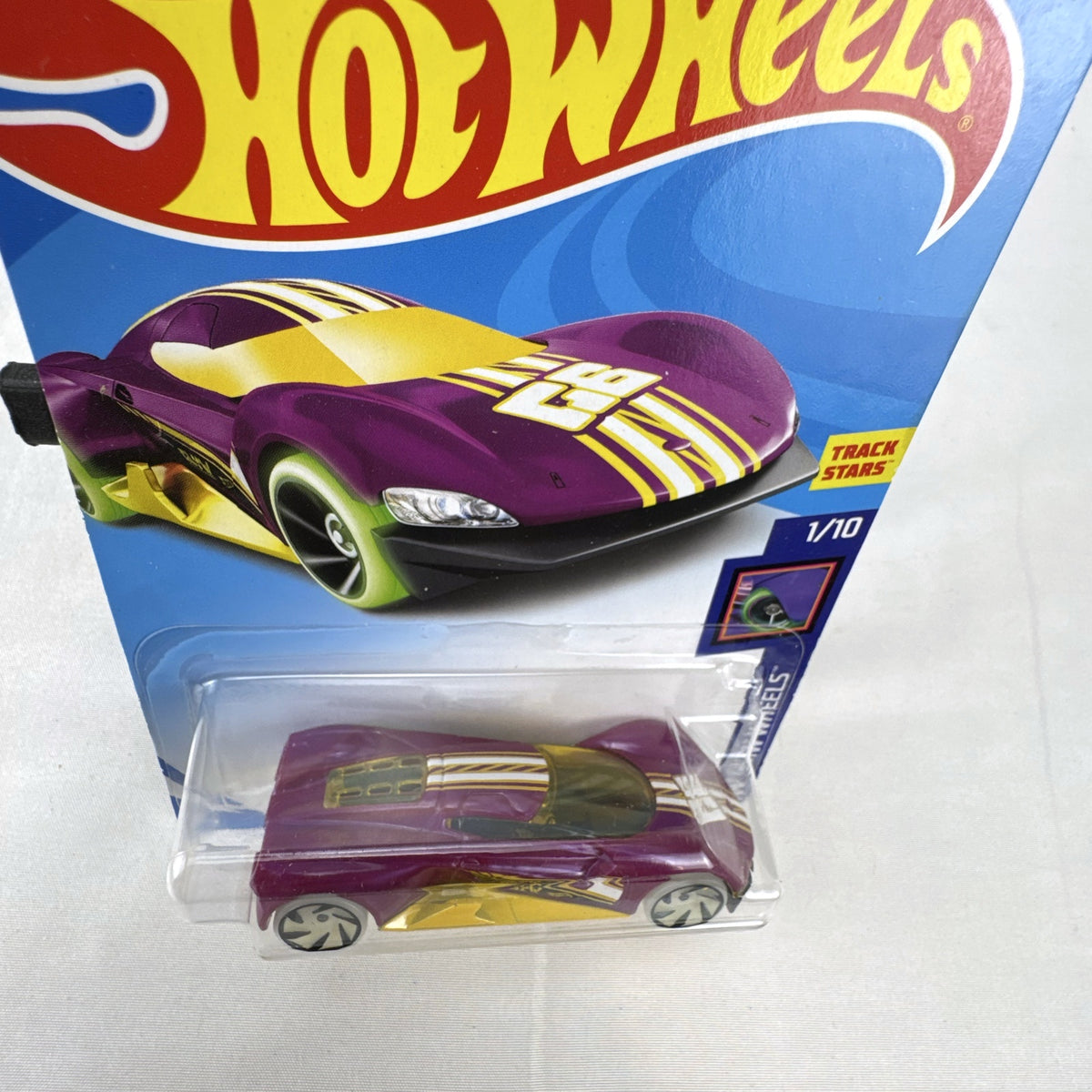 Hot Wheels 1:64 scale purple Crescendo diecast car factory sealed on 2017 HW Glow Wheels blister card.